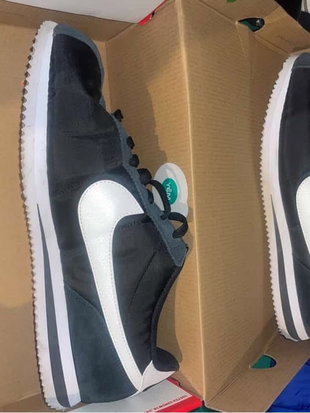 Nike Black and White Low-Top Cortez Sneakers